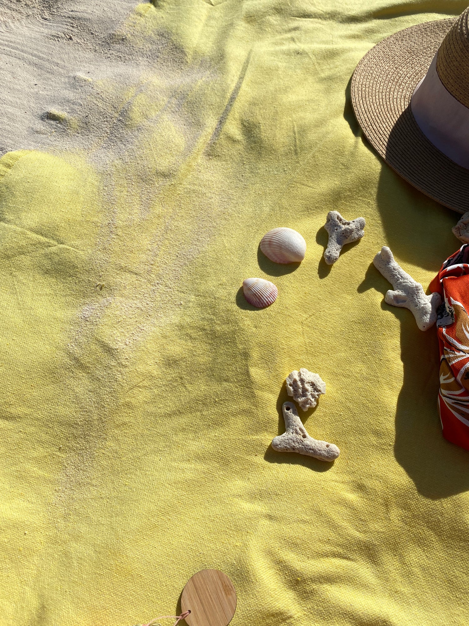 Beach towel covered with sand
