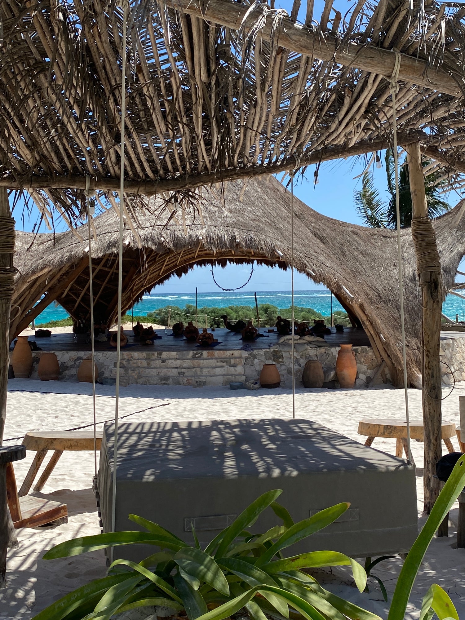 View of a beachfront Yoga class in Tulum